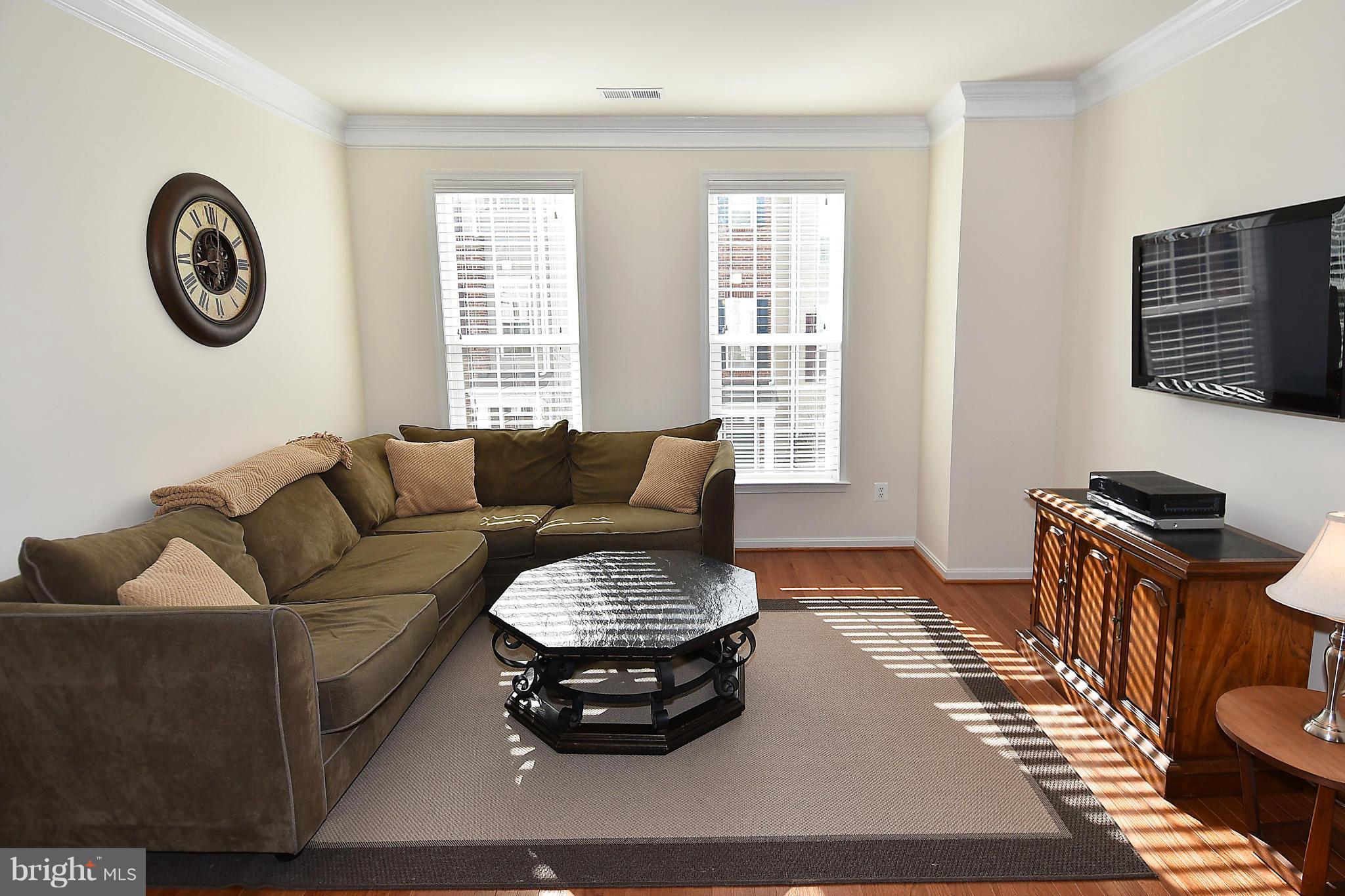 22641 Twitter Square Ashburn, VA 20148 - Photo 6 of 30 Living Rm w/ hardwood flooring/crown molding