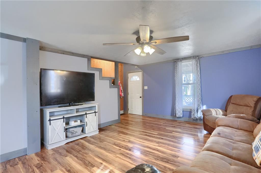 1204 Franklin Road Jackson Center, PA 16133 - Photo 12 of 26 a living room with furniture and a flat screen tv