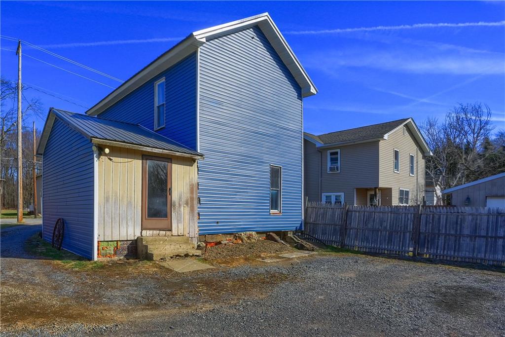 1204 Franklin Road Jackson Center, PA 16133 - Photo 5 of 26 a view of a house with wooden fence