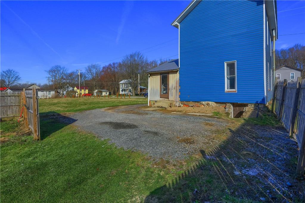 1204 Franklin Road Jackson Center, PA 16133 - Photo 6 of 26 a view of a house with a yard