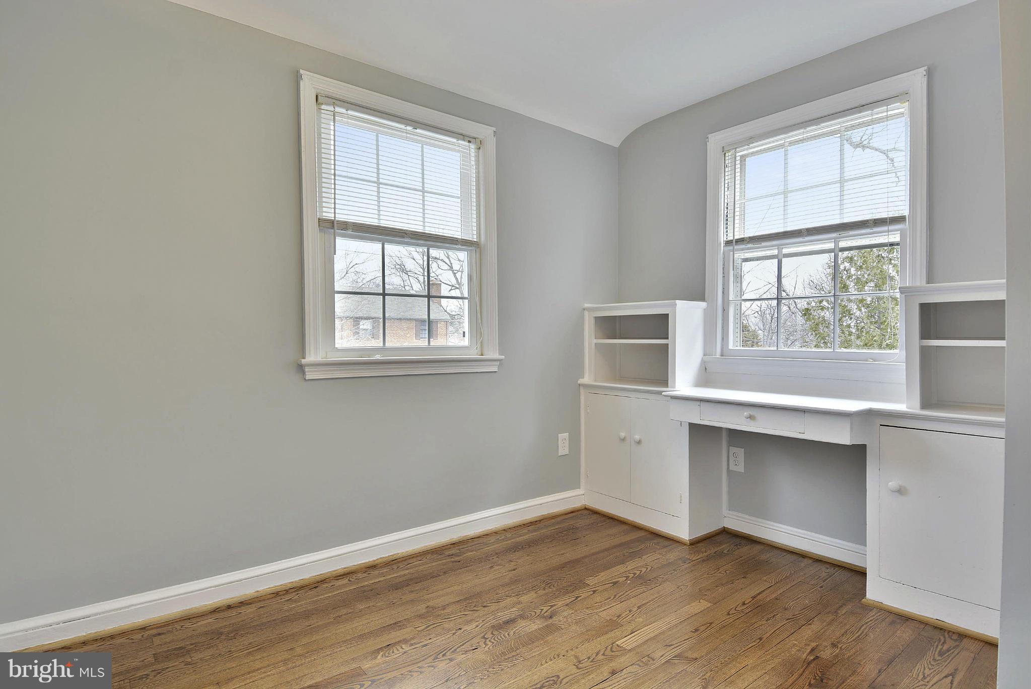 2706 Harmon Road Silver Spring, MD 20902 - Photo 15 of 30 Upper level bedroom with built in desk and shelves