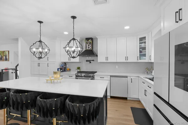 a kitchen with a dining table and chairs