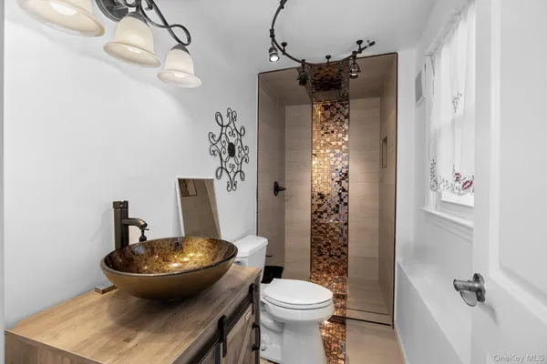 a view of a bathroom with a sink and toilet