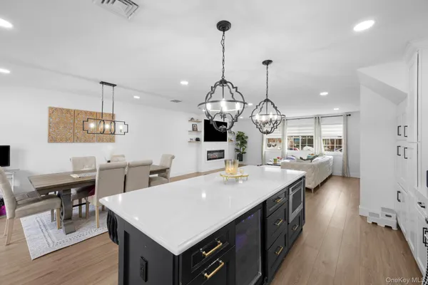 a large kitchen with a table and chairs