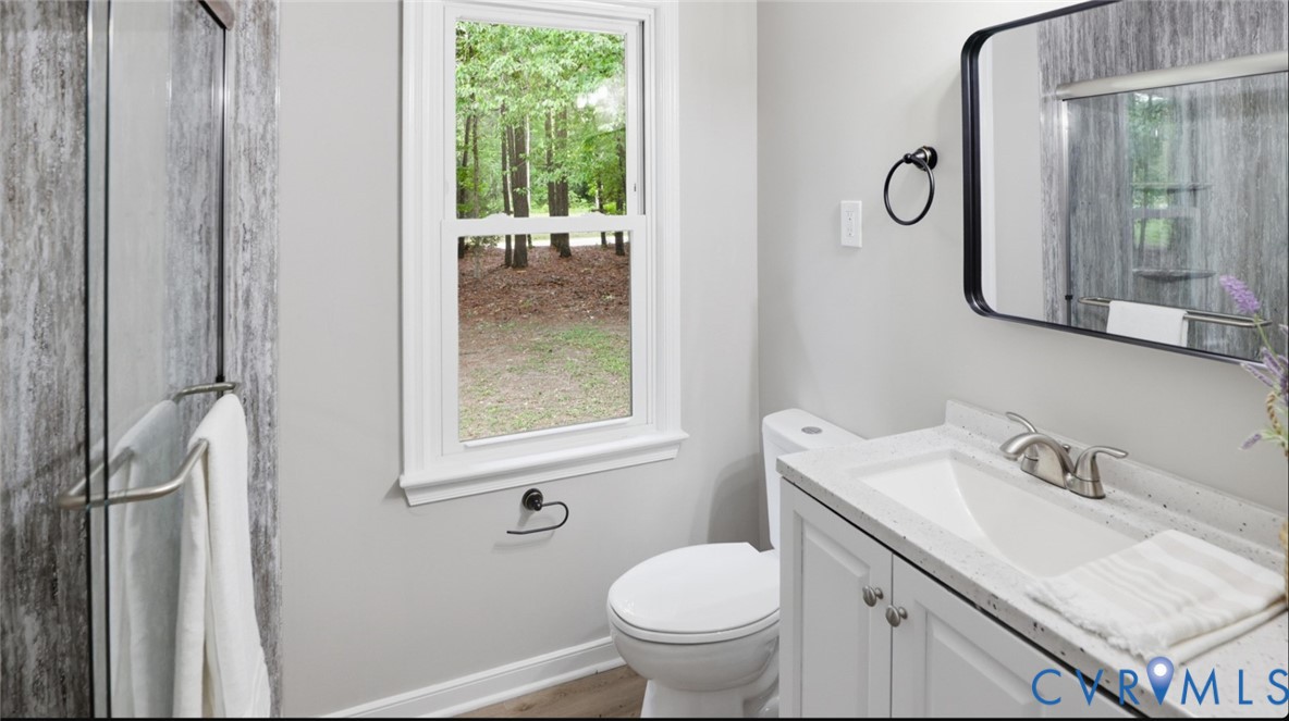 3200 Portugee Road Sandston, VA 23150 - Photo 23 of 26 a bathroom with a sink toilet and shower