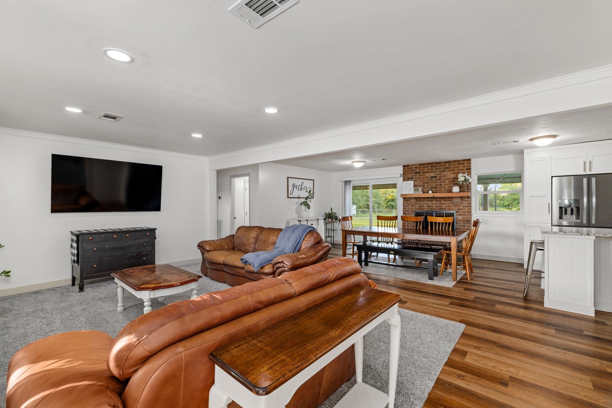66 County Road 511 Corinth, MS 38834 - Photo 4 of 40 Living area showcasing recessed lighting, light gray carpeting, and a wall-mounted display
