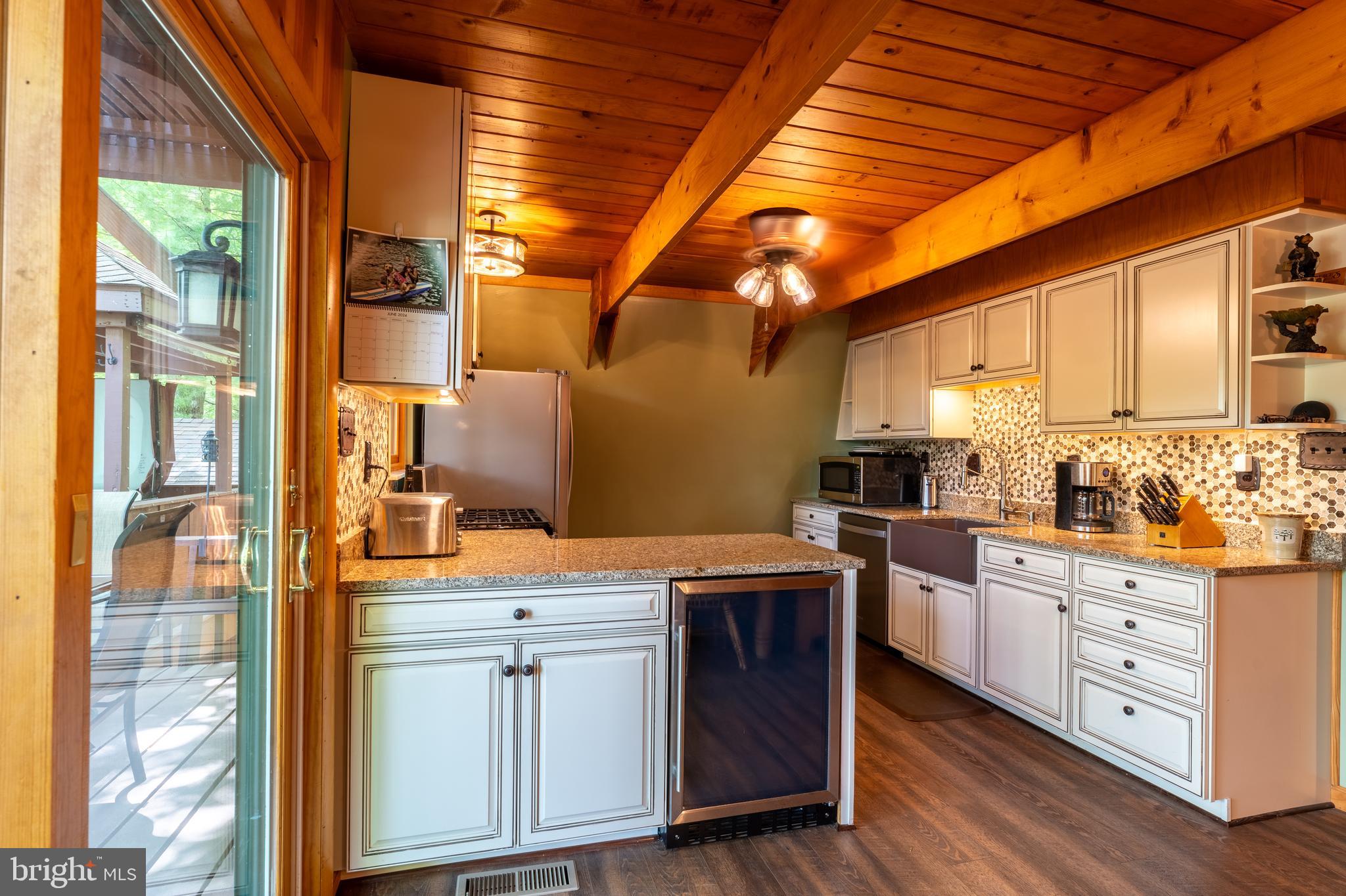 106 Oak Way Road Swanton, MD 21561 - Photo 12 of 47 Custom kitchen cabinetry, convenient mini fridge