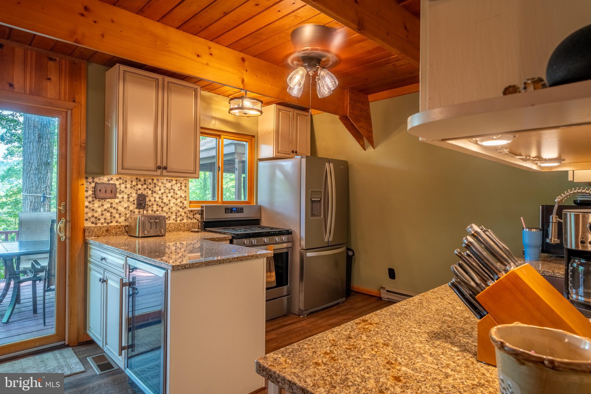 106 Oak Way Road Swanton, MD 21561 - Photo 13 of 47 Granite countertops, under cabinet lighting