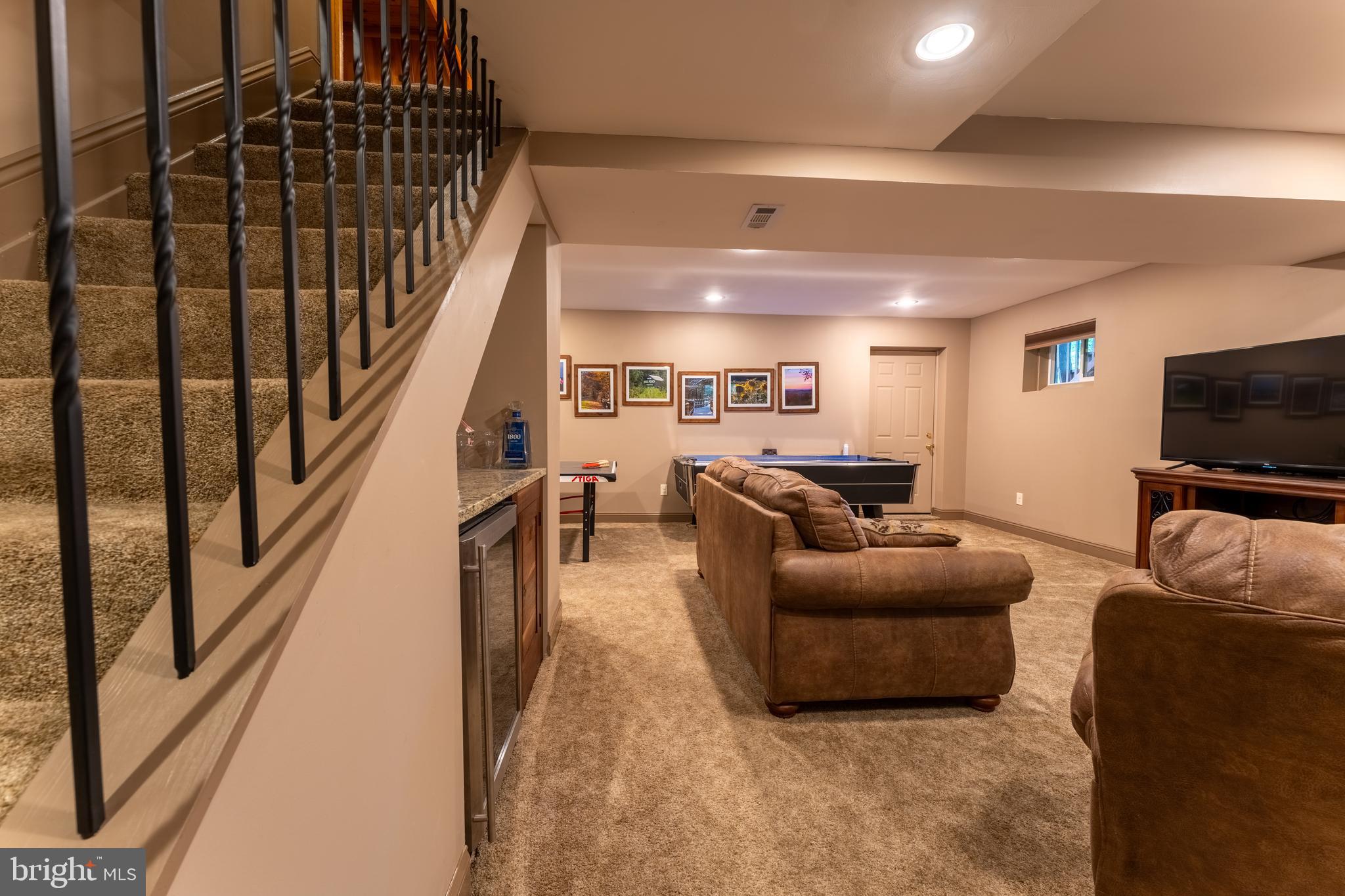 106 Oak Way Road Swanton, MD 21561 - Photo 24 of 47 Family room with exit to outside and mini fridge