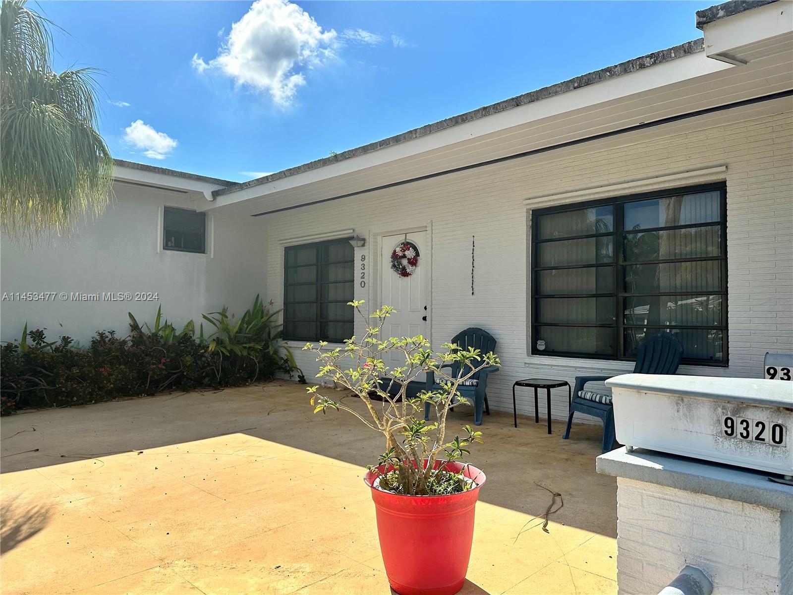 9320 Southwest 125th Terrace Miami, FL 33176 - Photo 1 of 31 a dining room with furniture and a potted plant
