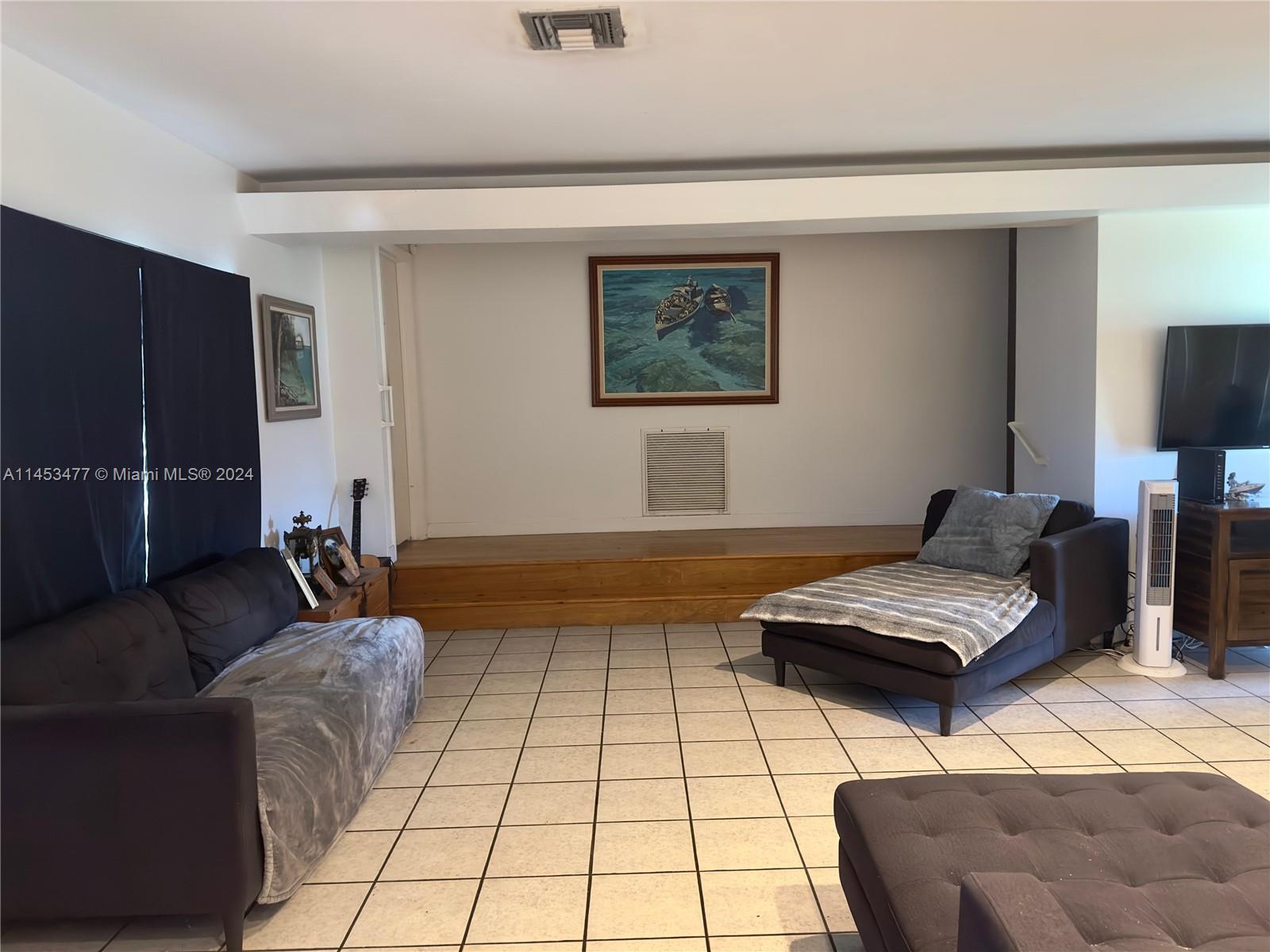 9320 Southwest 125th Terrace Miami, FL 33176 - Photo 11 of 31 a living room with furniture and a rug