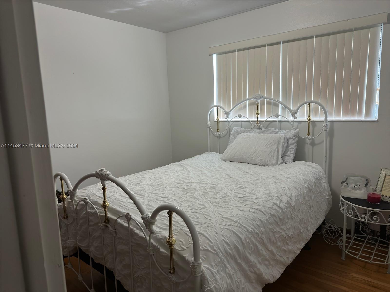 9320 Southwest 125th Terrace Miami, FL 33176 - Photo 12 of 31 a bedroom with a bed and a table in it