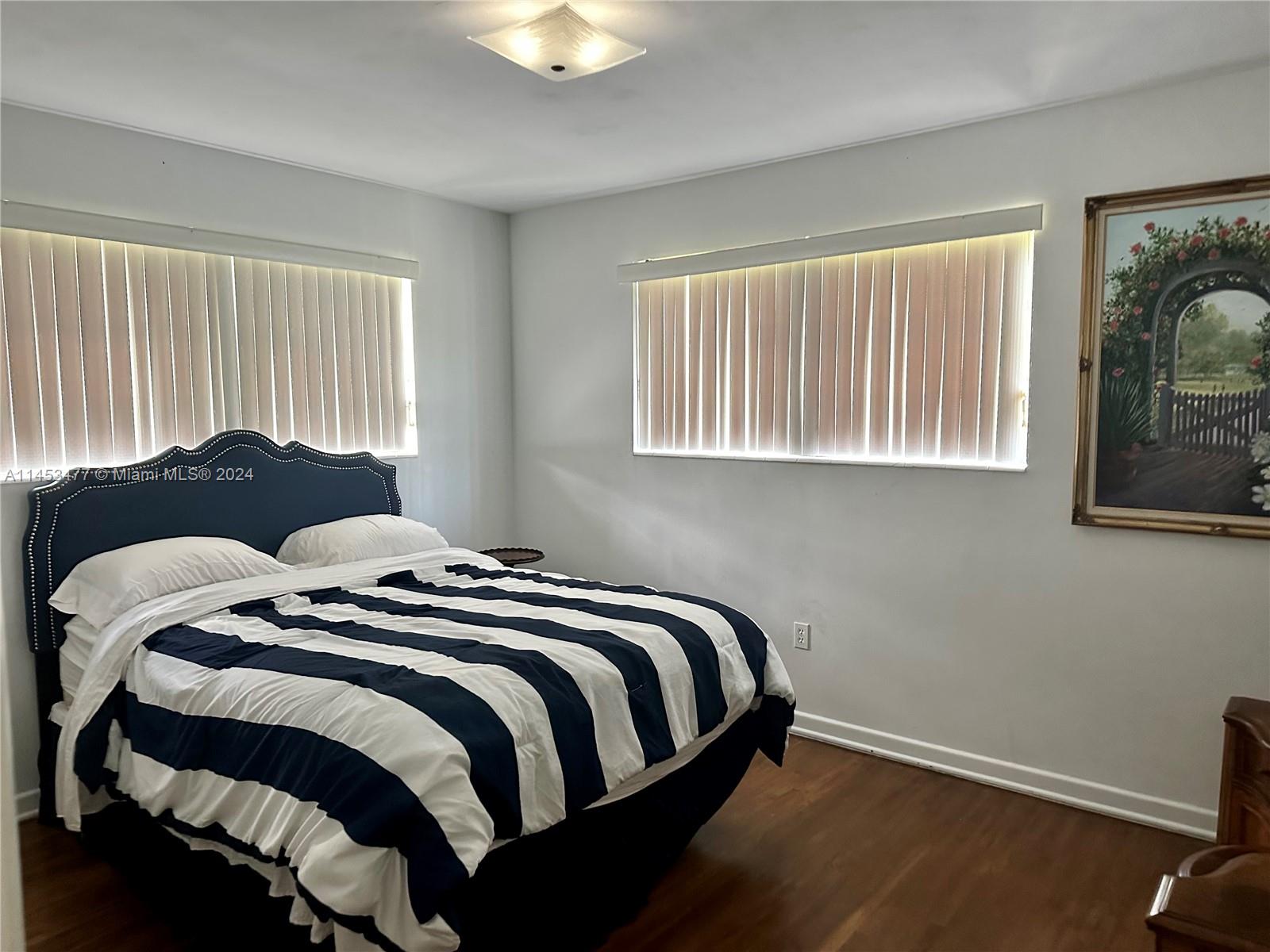 9320 Southwest 125th Terrace Miami, FL 33176 - Photo 13 of 31 a bedroom with a bed and a window