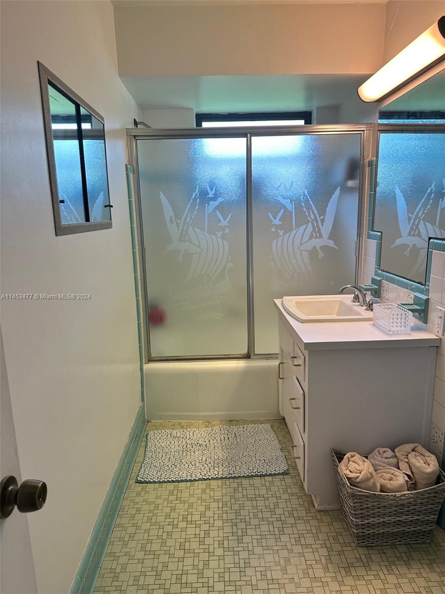 9320 Southwest 125th Terrace Miami, FL 33176 - Photo 14 of 31 a bathroom with a sink and a mirror