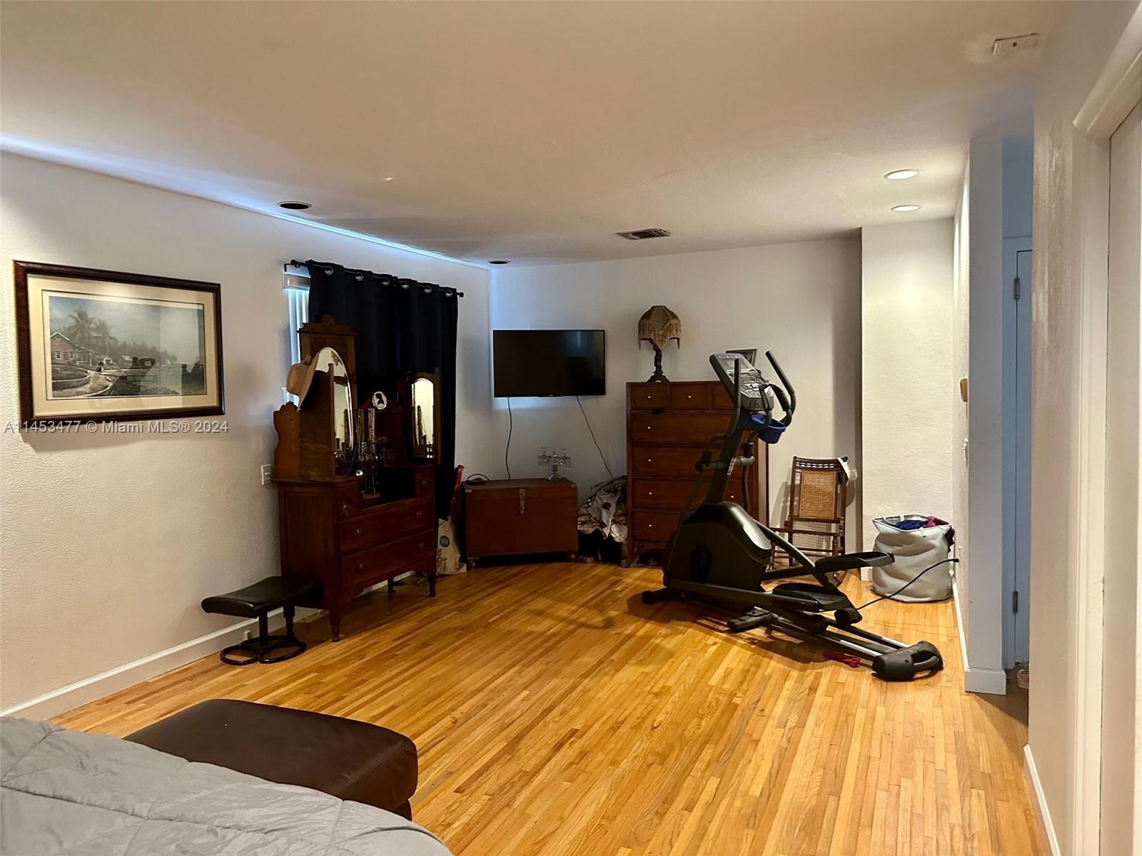 9320 Southwest 125th Terrace Miami, FL 33176 - Photo 16 of 31 a room with gym equipment and a mirror