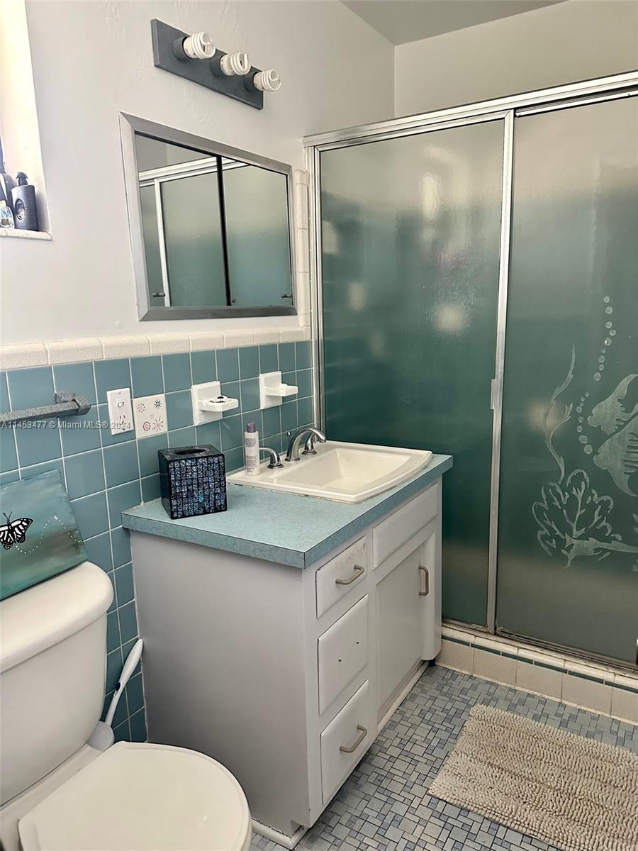 9320 Southwest 125th Terrace Miami, FL 33176 - Photo 17 of 31 a bathroom with a sink toilet and shower