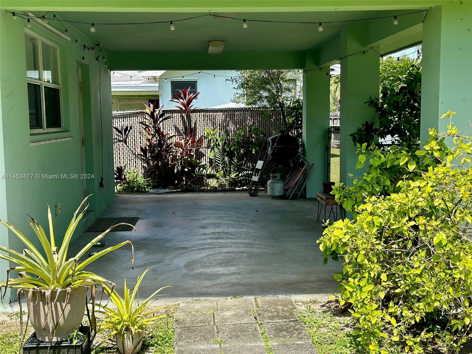 9320 Southwest 125th Terrace Miami, FL 33176 - Photo 21 of 31 a front view of a house with a yard
