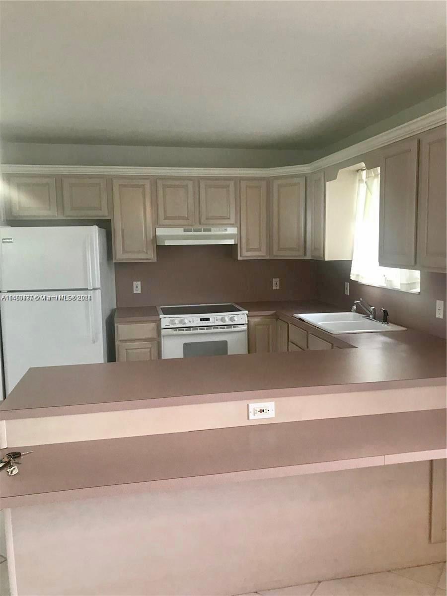 9320 Southwest 125th Terrace Miami, FL 33176 - Photo 23 of 31 a view of kitchen and utility room