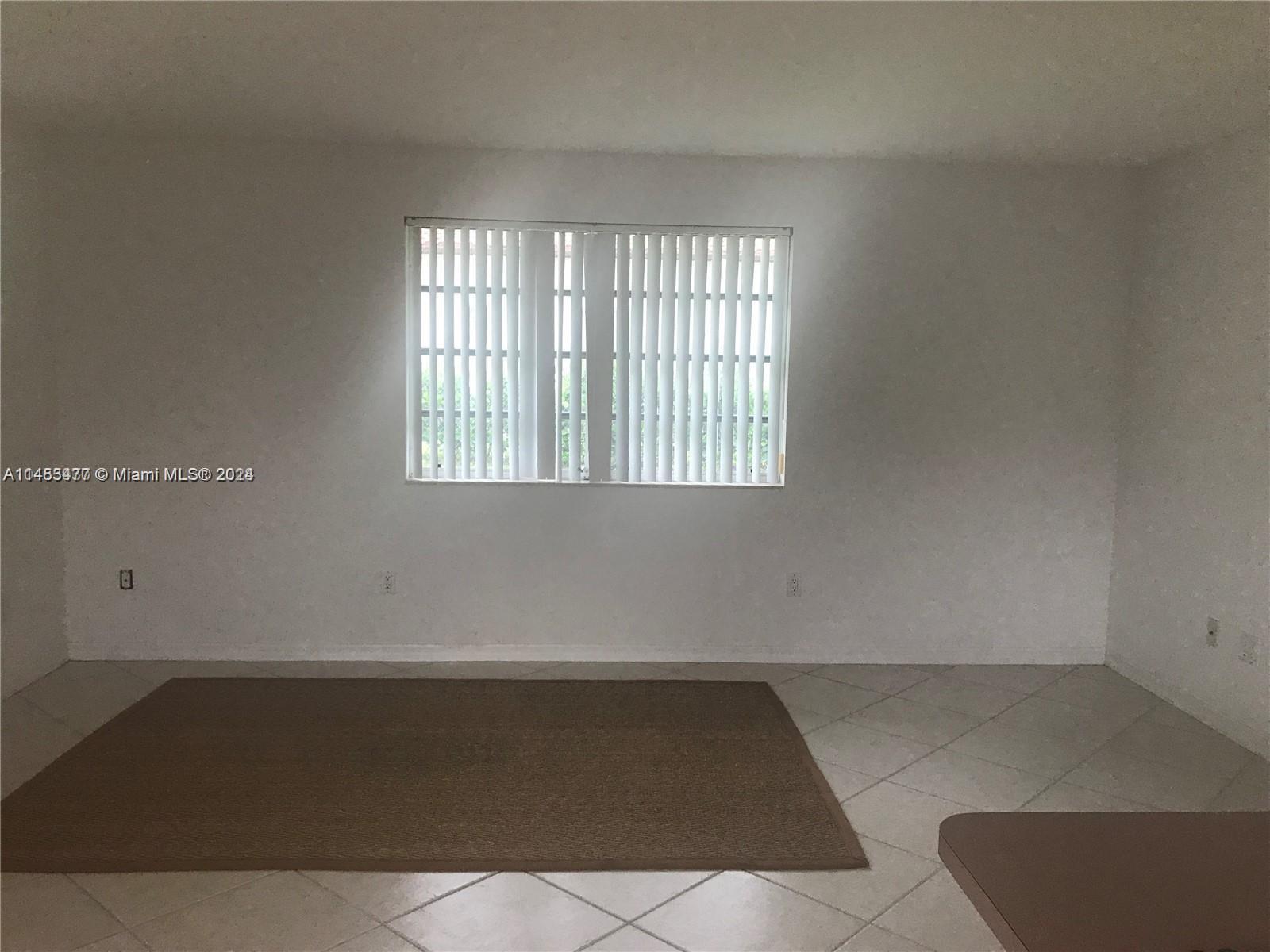 9320 Southwest 125th Terrace Miami, FL 33176 - Photo 25 of 31 an empty room with a window