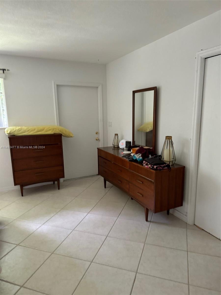9320 Southwest 125th Terrace Miami, FL 33176 - Photo 27 of 31 a room with a dresser and a window