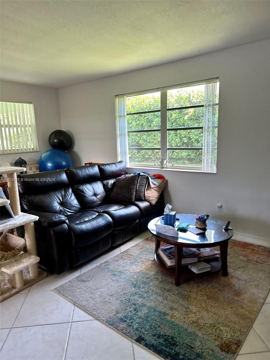 9320 Southwest 125th Terrace Miami, FL 33176 - Photo 31 of 31 a living room with furniture and a window
