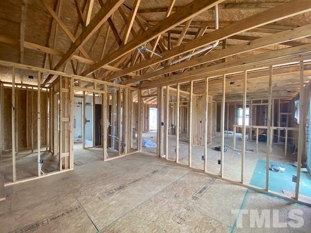 155 Mamie Road Benson, NC 27504 - Photo 8 of 23 a view of an empty room with wooden frame