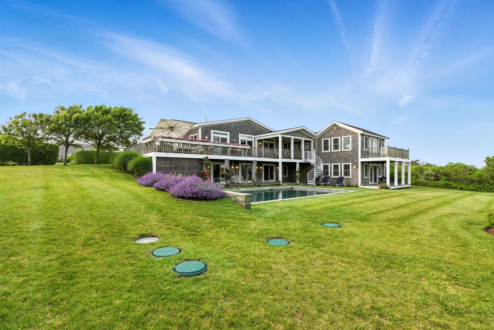 45 Starbuck Road Nantucket, MA 02554 - Photo 4 of 42 a view of a house with a big yard and large trees