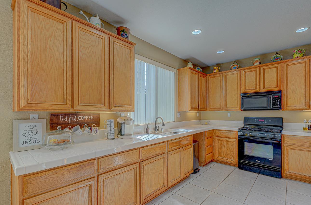2 Whitman Circle Salinas, CA 93906 - Photo 13 of 41 a kitchen with stainless steel appliances granite countertop a sink a stove and cabinets