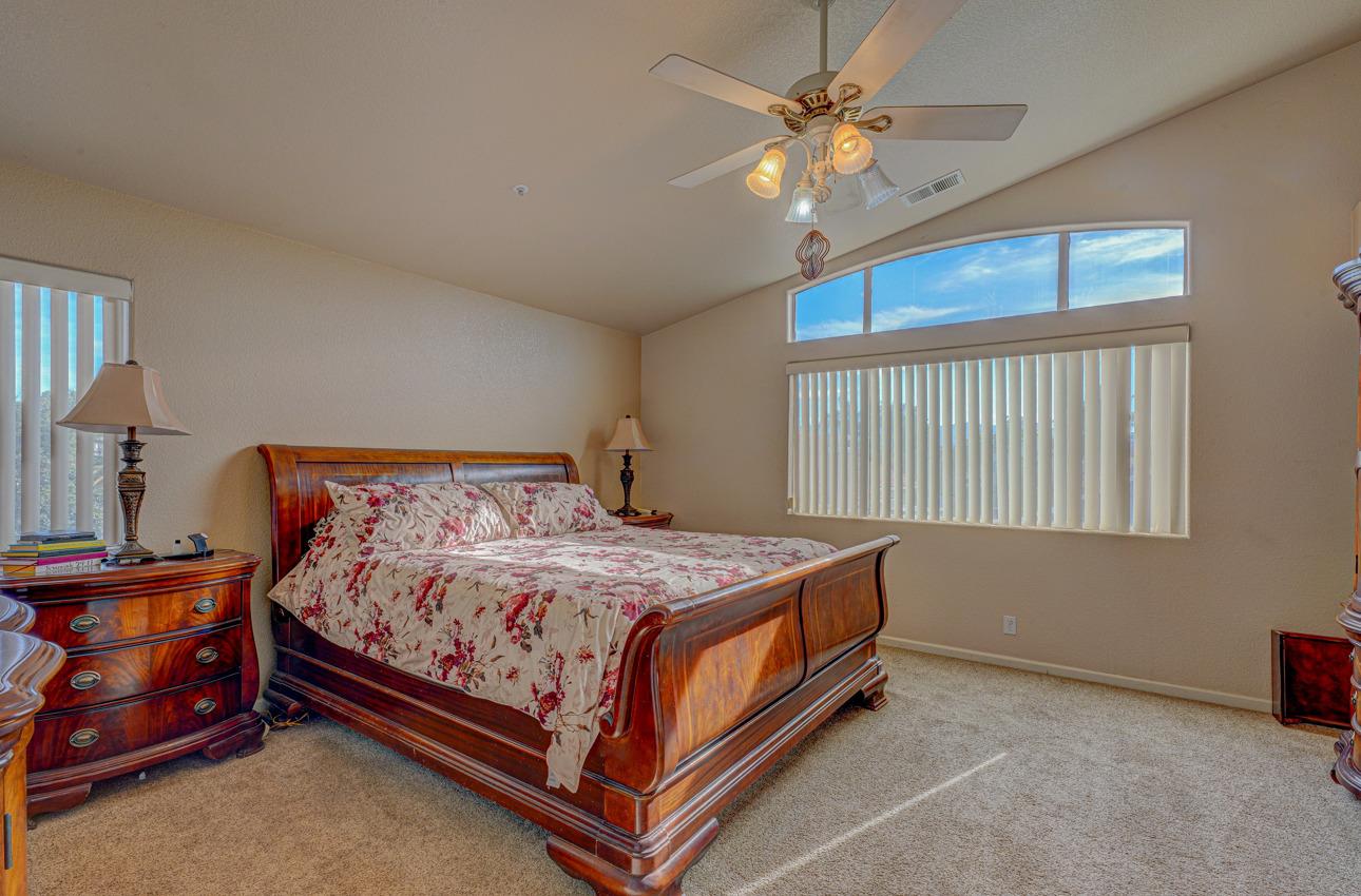 2 Whitman Circle Salinas, CA 93906 - Photo 28 of 41 a bedroom with a bed and a chandelier