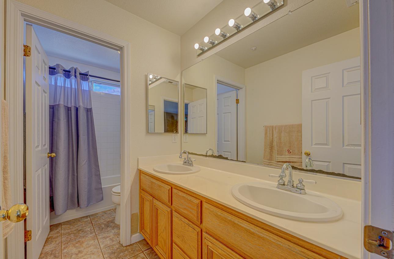 2 Whitman Circle Salinas, CA 93906 - Photo 36 of 41 a bathroom with double vanity sinks and a mirror