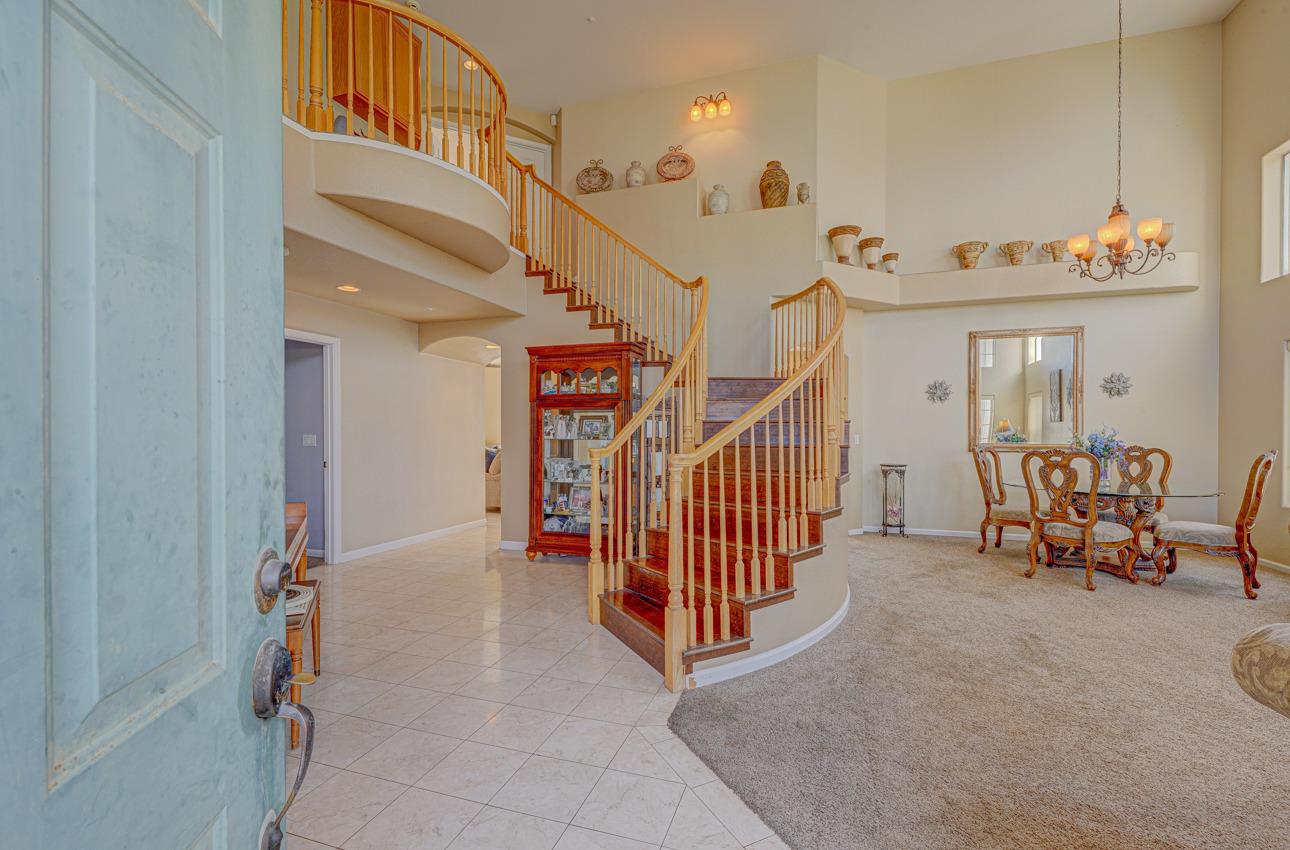 2 Whitman Circle Salinas, CA 93906 - Photo 4 of 41 a view of a hallway with dining room and stairs