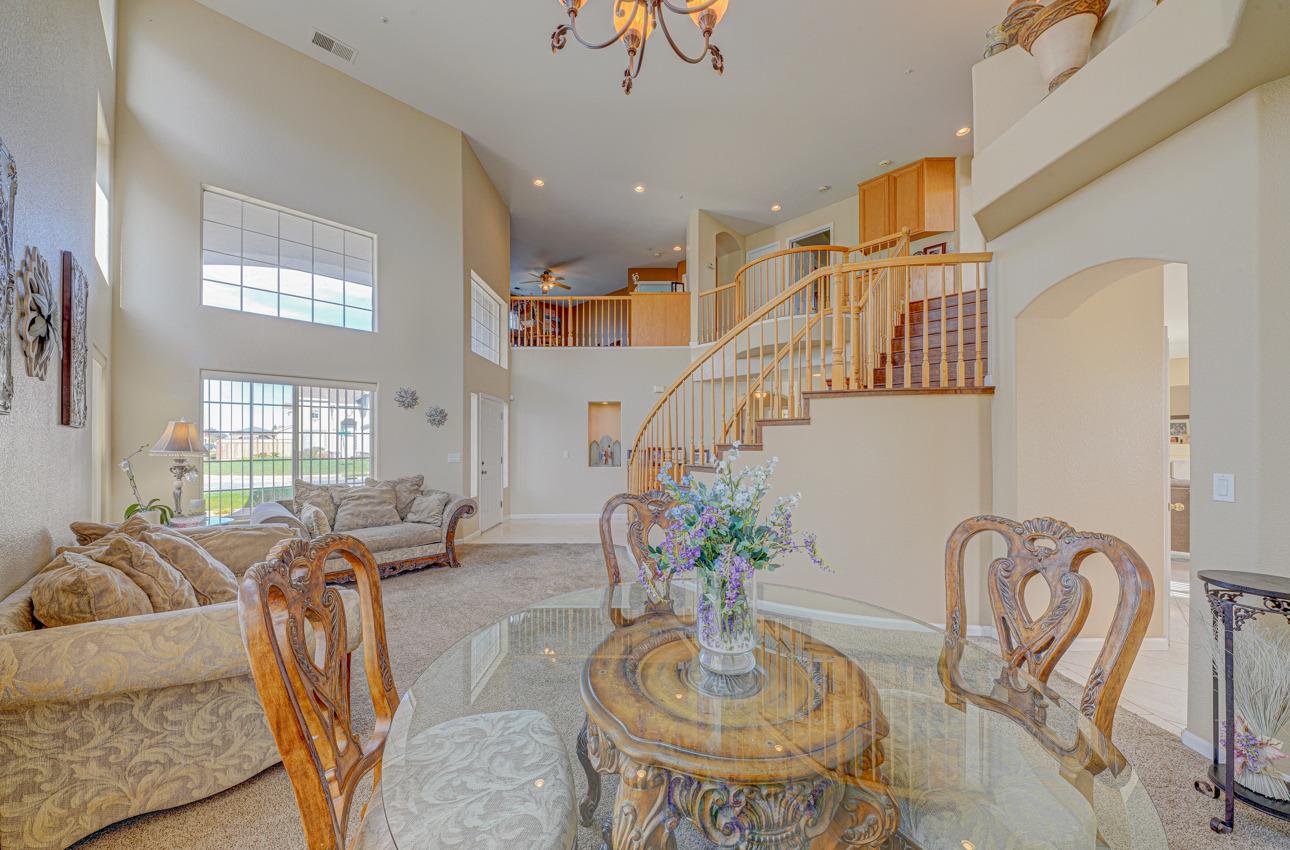 2 Whitman Circle Salinas, CA 93906 - Photo 9 of 41 a living room with furniture potted plant and a chandelier