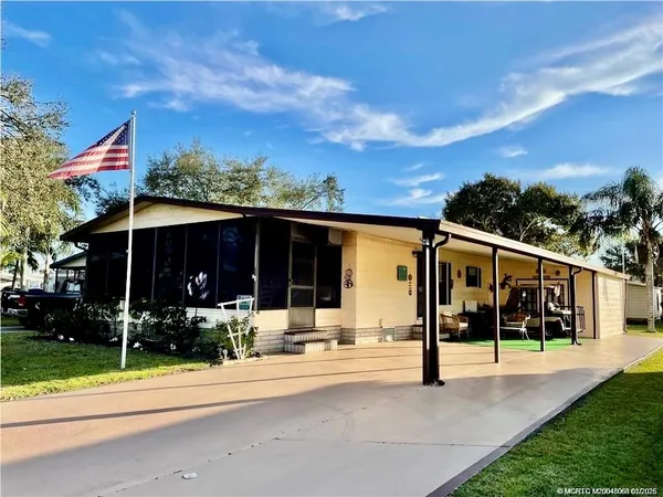 a view of a building with a yard