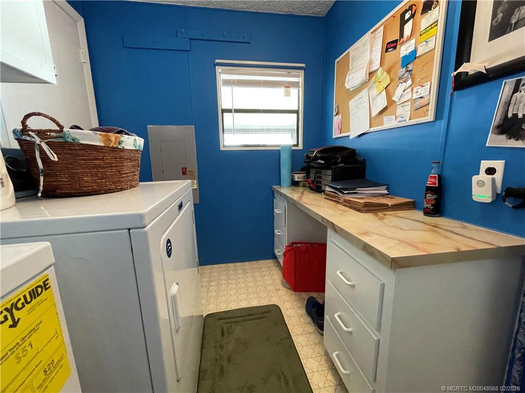 16236 Southwest Three Wood Way Indiantown, FL 34956 - Photo 20 of 26 a utility room with dryer and washer