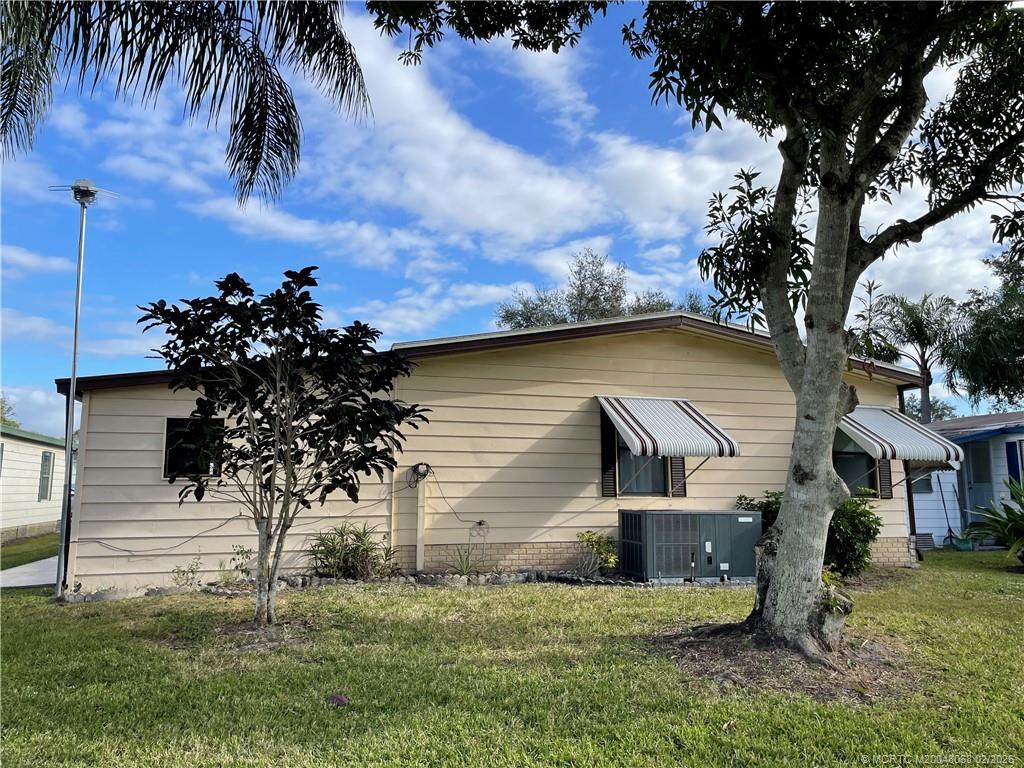 16236 Southwest Three Wood Way Indiantown, FL 34956 - Photo 24 of 26 a view of a house with a yard