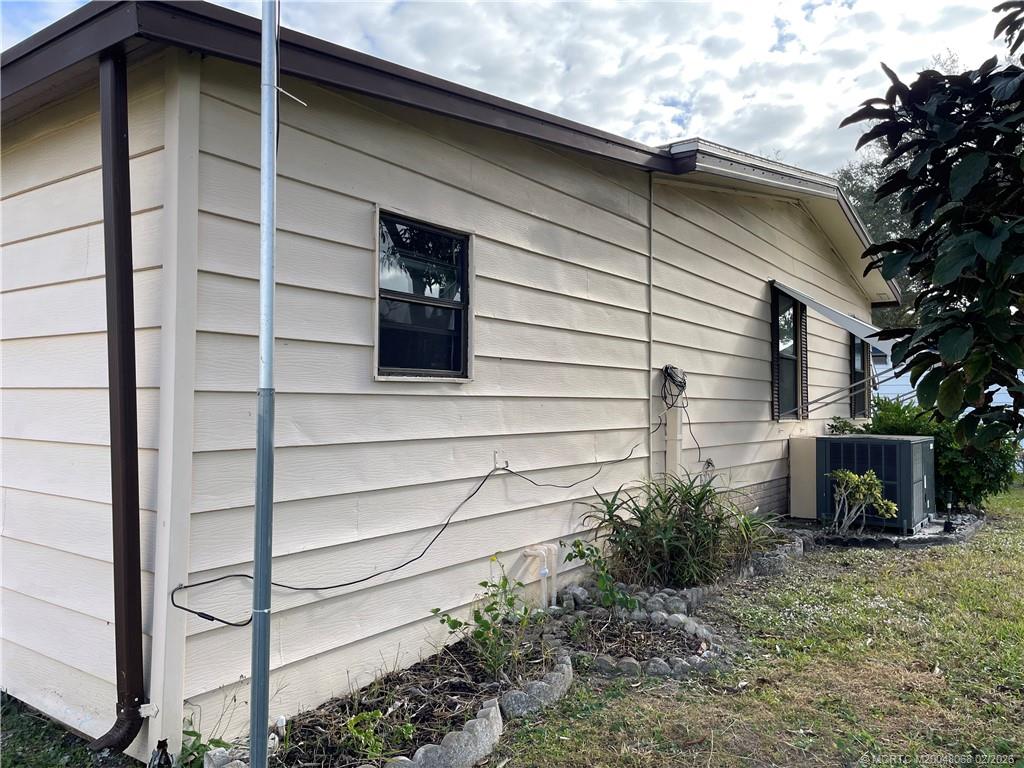 16236 Southwest Three Wood Way Indiantown, FL 34956 - Photo 25 of 26 a front view of a house with a yard