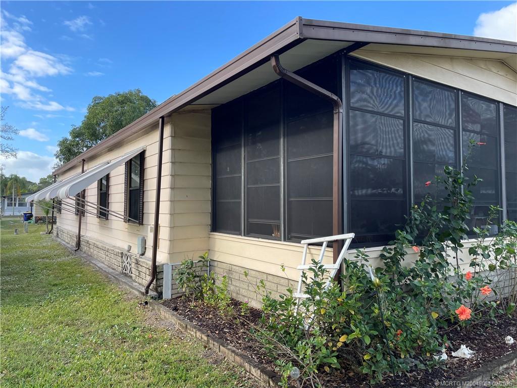 16236 Southwest Three Wood Way Indiantown, FL 34956 - Photo 26 of 26 a front view of a house with garden