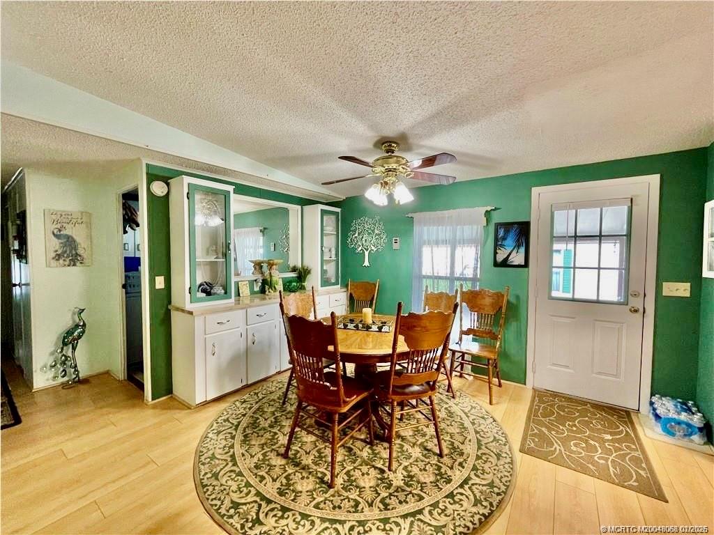 16236 Southwest Three Wood Way Indiantown, FL 34956 - Photo 4 of 26 a view of a dining room with furniture