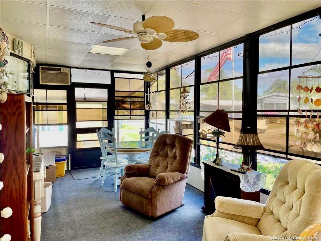 16236 Southwest Three Wood Way Indiantown, FL 34956 - Photo 8 of 26 a living room with furniture and a large window
