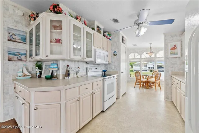 a kitchen with counter top space and wooden cabinets