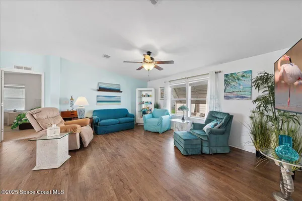 a living room with furniture gym equipment and a fireplace