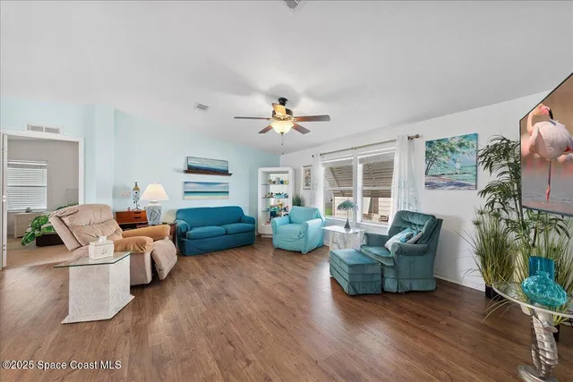 a living room with furniture gym equipment and a fireplace