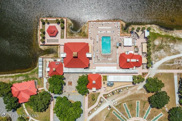 an aerial view of residential house with outdoor space and swimming pool