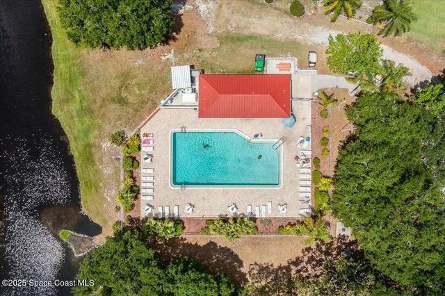 a view of a wooden bench in front of a house