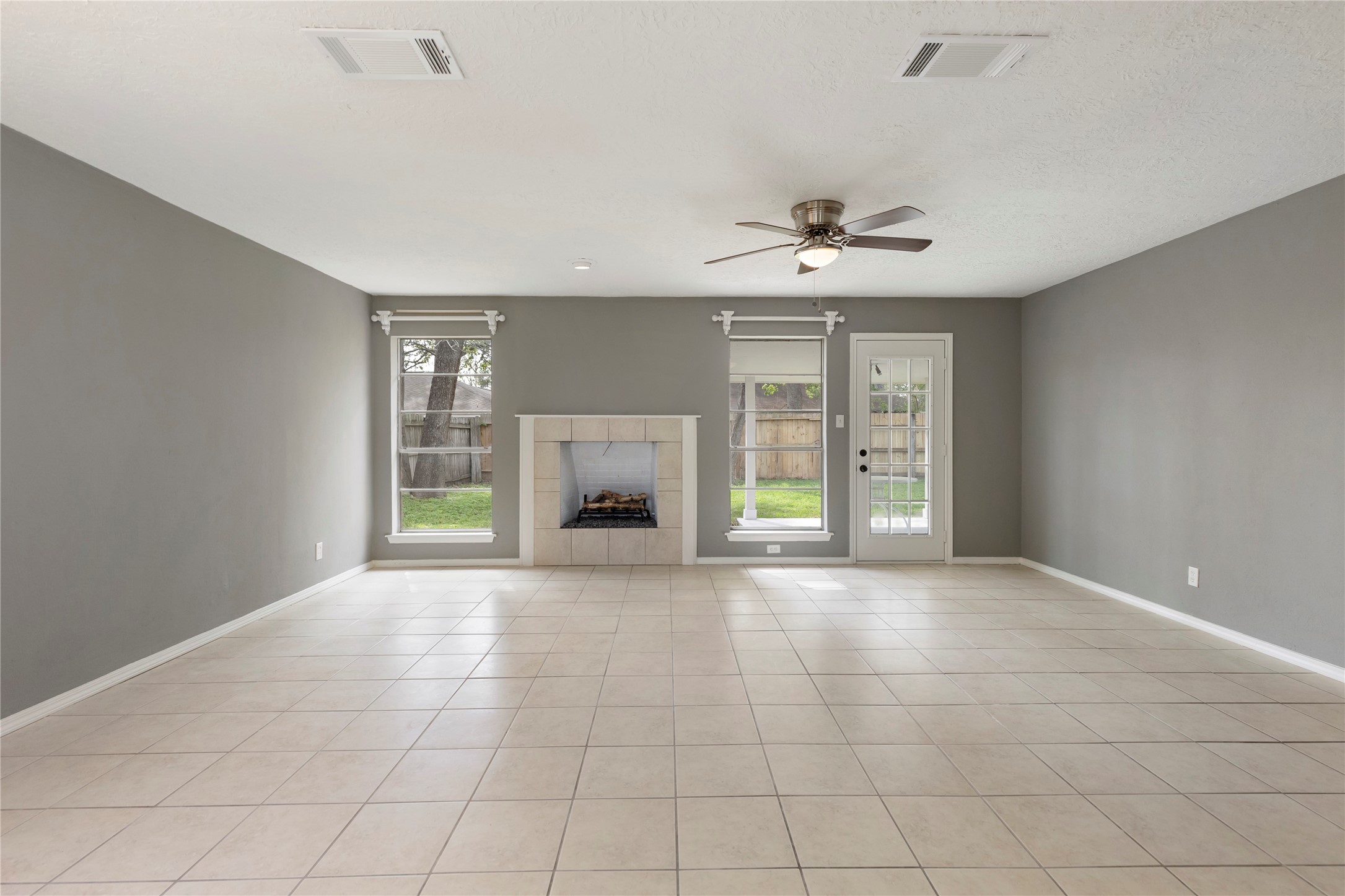29107 Binefield Street Spring, TX 77386 - Photo 12 of 33 Plenty of natural light in the family room. Blinds to be installed soon! Fireplace is decorative only and is not functional.