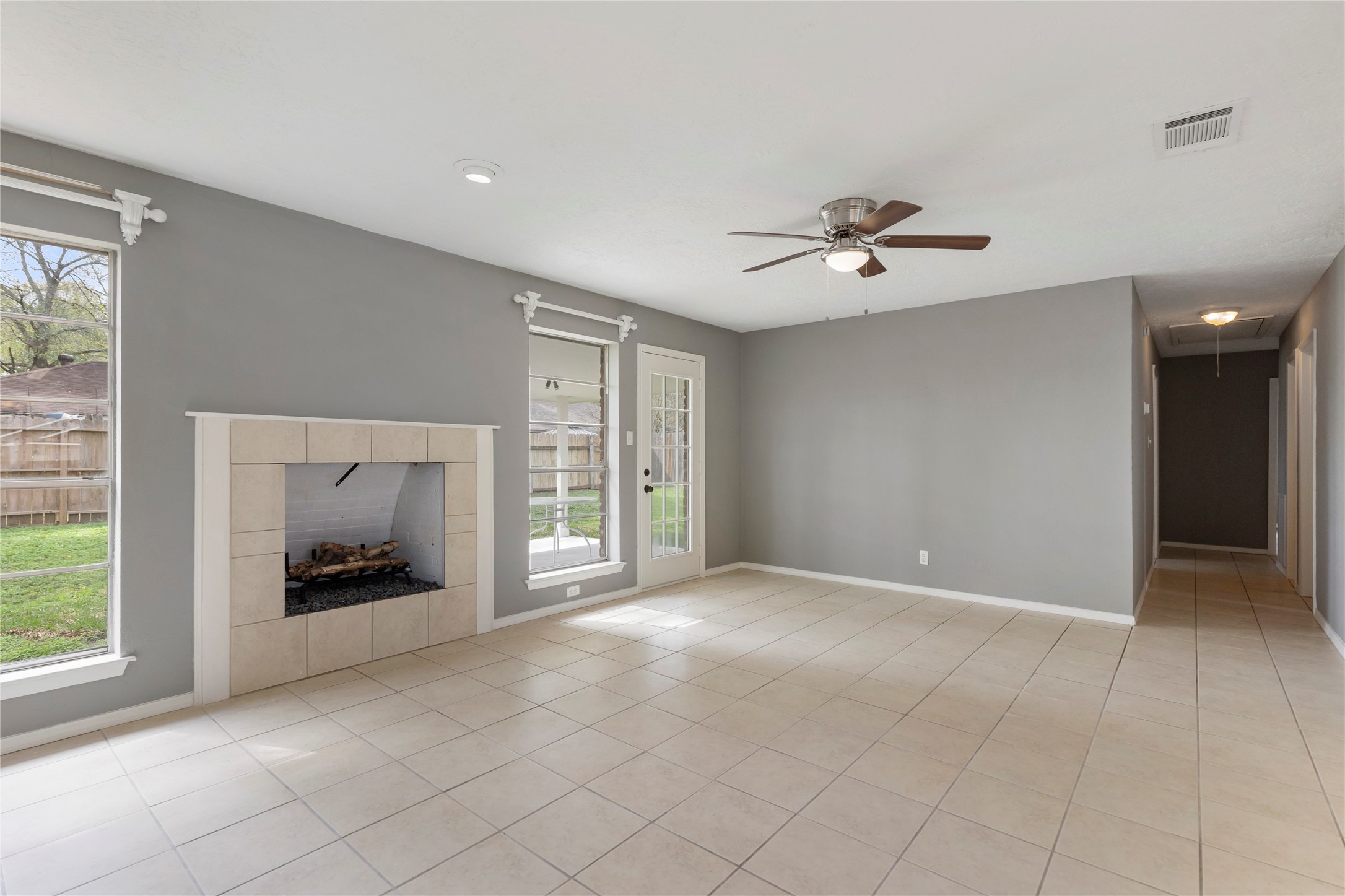 29107 Binefield Street Spring, TX 77386 - Photo 14 of 33 Hallway leads to bedrooms. Fireplace is decorative only and is not functional.