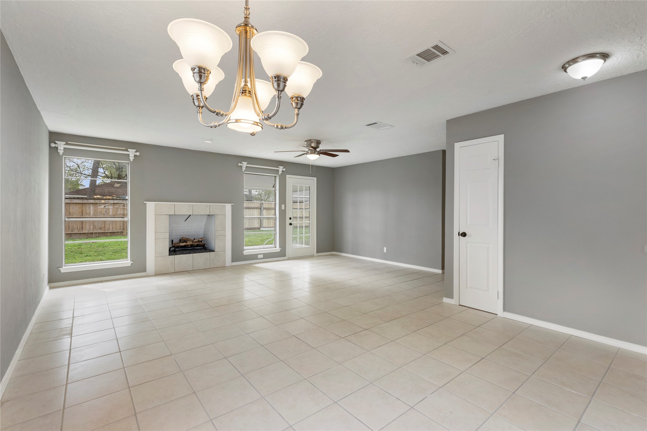 29107 Binefield Street Spring, TX 77386 - Photo 6 of 33 Kitchen area and family room. Fireplace is decorative only and is not functional.