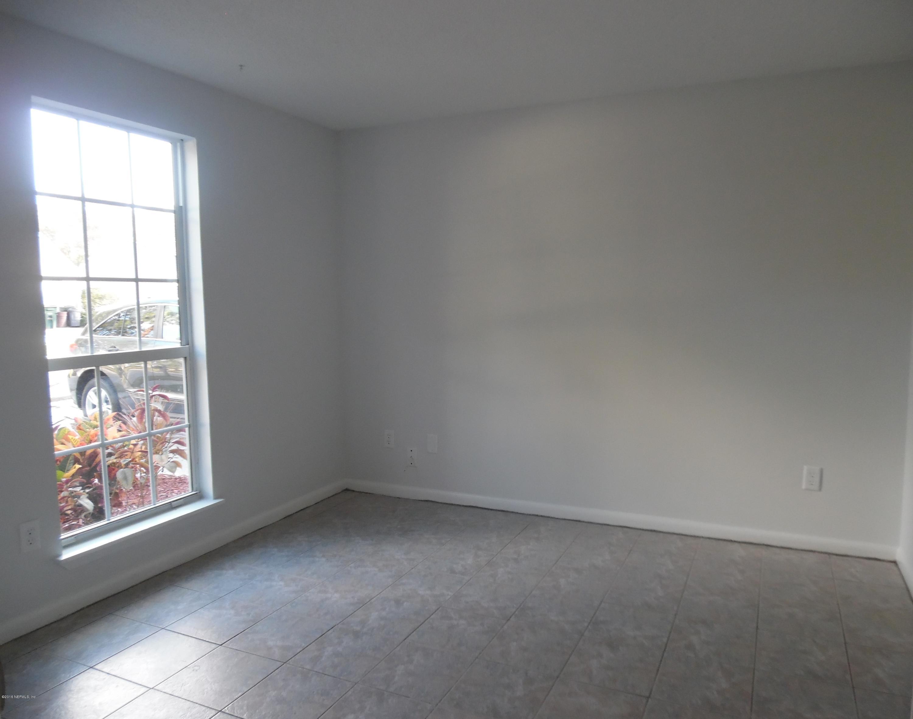 10244 Pine Breeze Road South Jacksonville, FL 32257 - Photo 12 of 27 an empty room with windows
