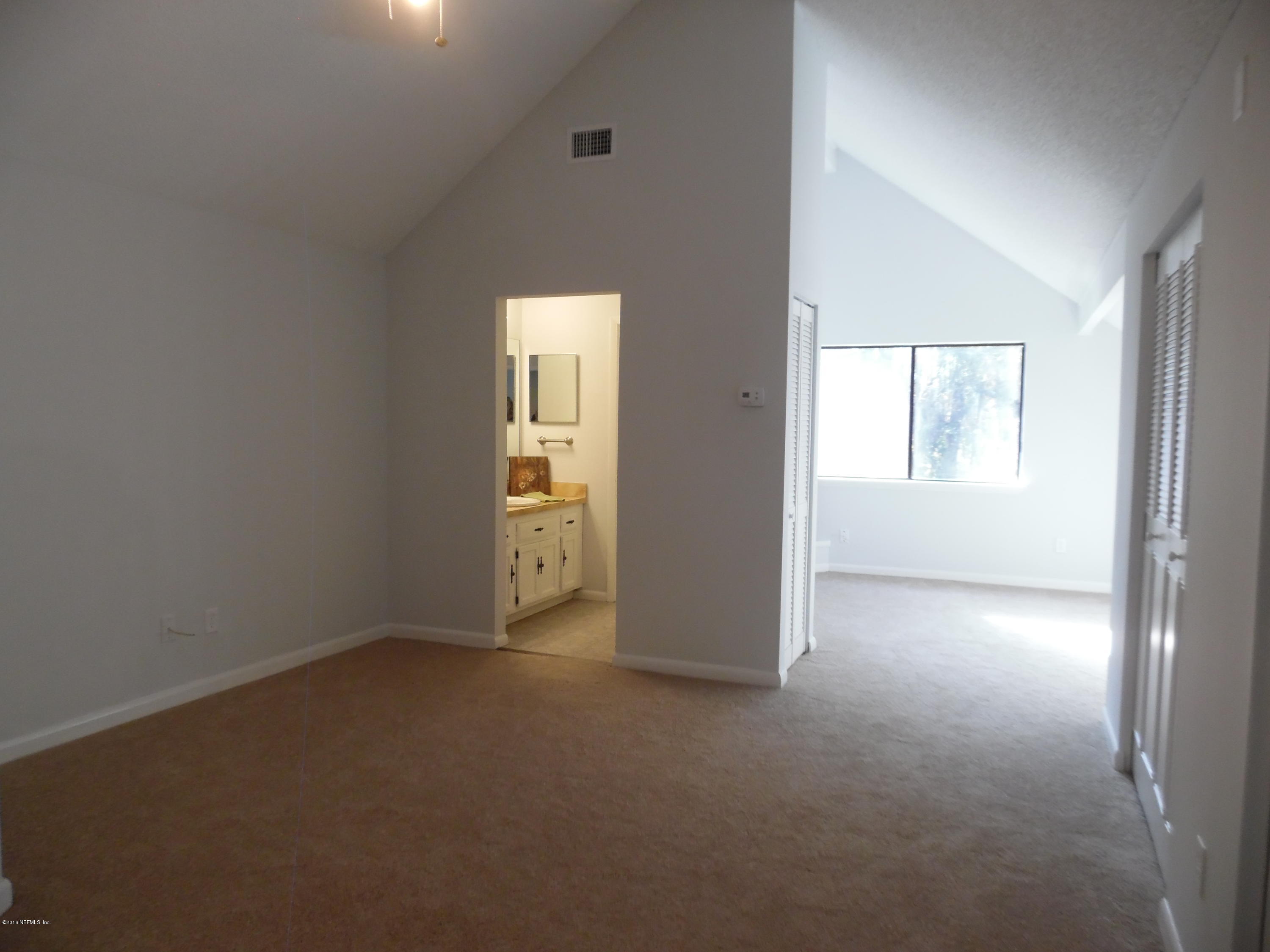 10244 Pine Breeze Road South Jacksonville, FL 32257 - Photo 15 of 27 an empty room with windows