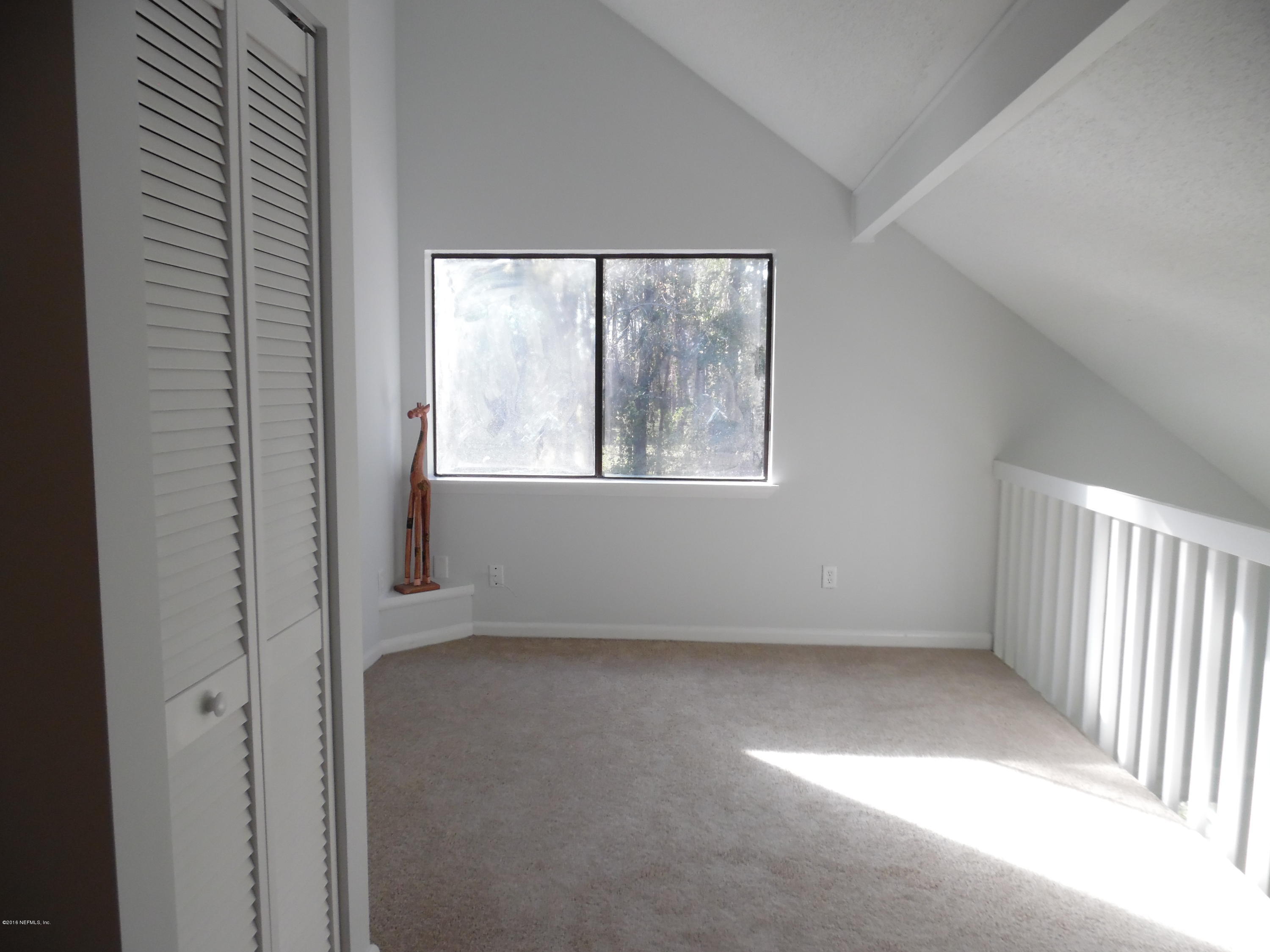 10244 Pine Breeze Road South Jacksonville, FL 32257 - Photo 16 of 27 an empty room with a window